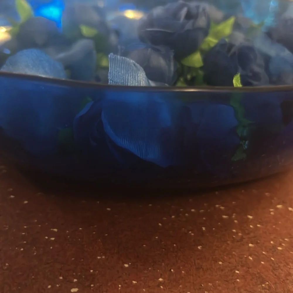 Something blue before I do decorations. Blue plastic bowl. Blue roses and petals